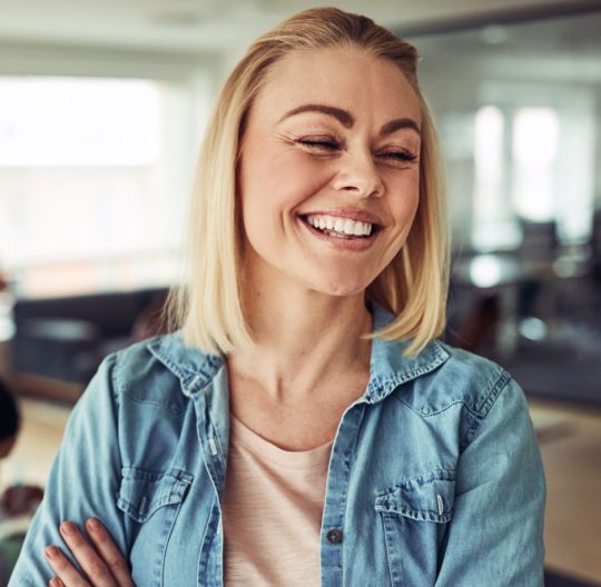 laughing-young-businesswoman-with-colleagues.jpg