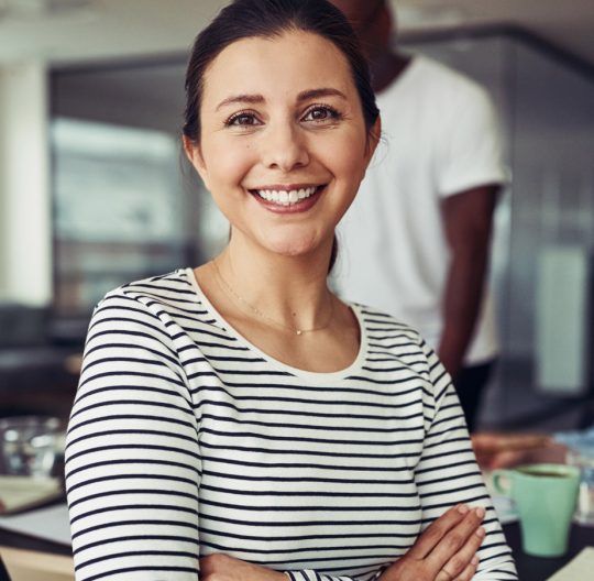 smiling-young-businesswoman-sitting-with.jpg